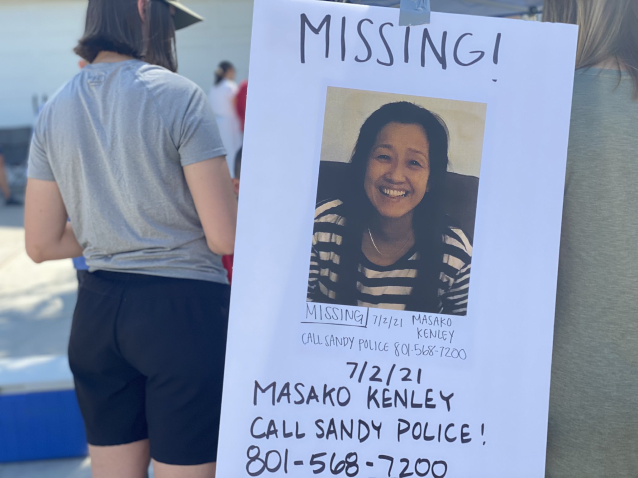 A flyer is shown at a search for 53-year-old Masako Kenley on Sunday, July 4.