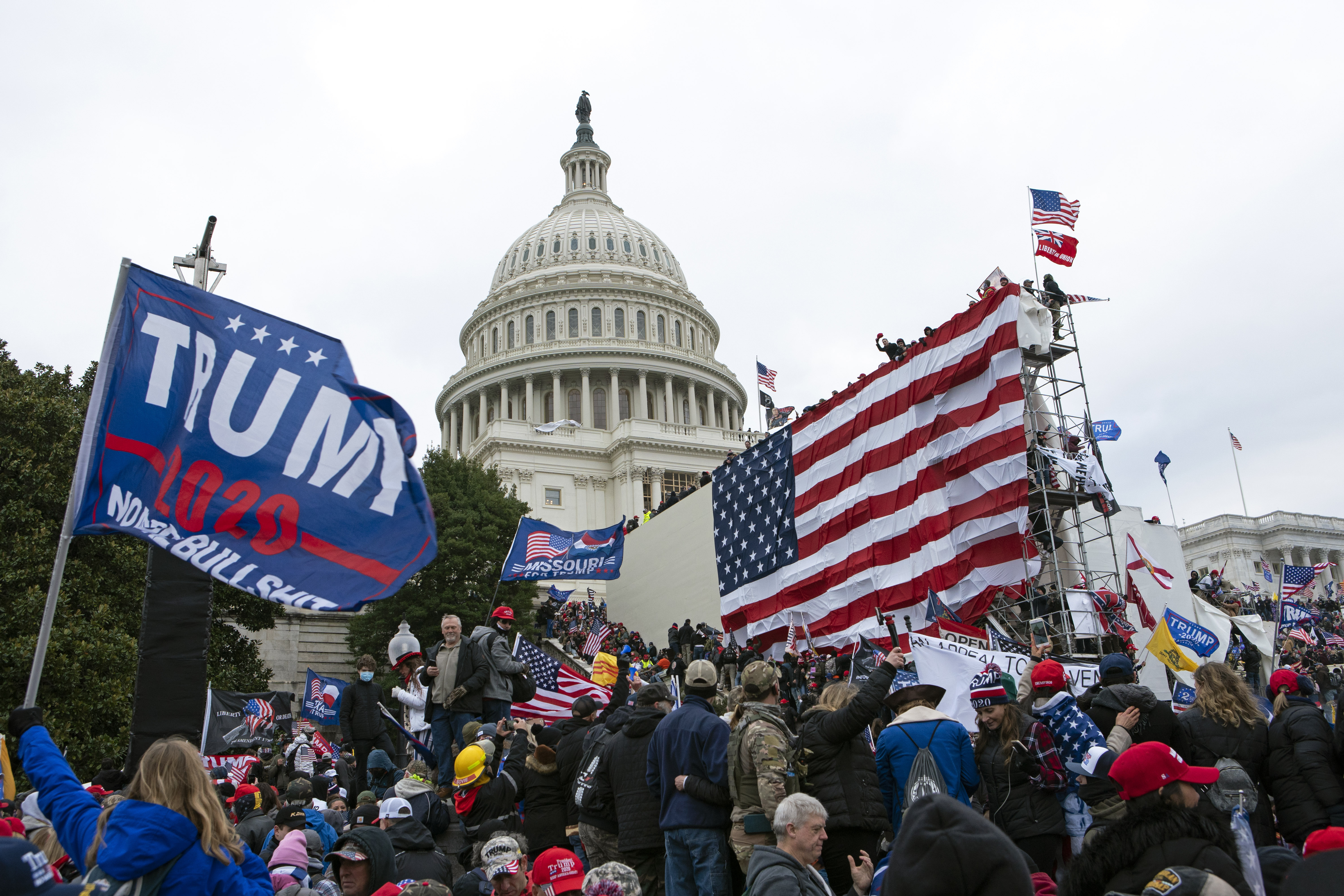Rioters loyal to then-President Donald Trump outside of the U.S. Capitol on Jan. 6, 2021, in Washington. Even as the first of the more than 500 federal Capitol riot defendants have begun to plead guilty, scores of suspects remain unidentified.