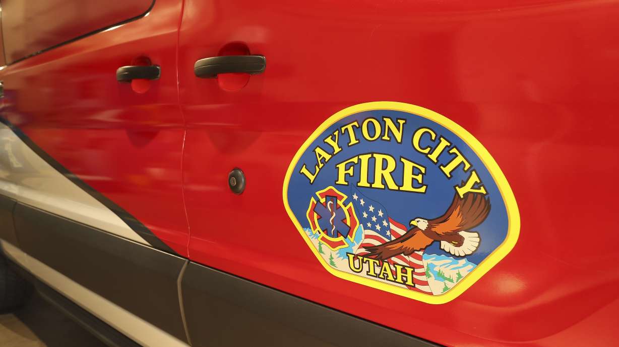 Layton firefighters extinguished a house fire Tuesday afternoon that started after a live power line fell and started a tree on fire near the home.