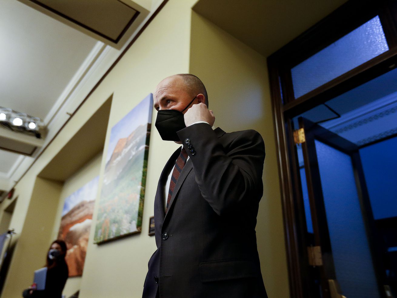 Gov. Spencer Cox arrives for a weekly briefing on COVID-19 at the Capitol in Salt Lake City on Thursday, May 13,
2021. Utahns still give Cox high marks for his handling of the COVID-19 pandemic, but they are split over the efforts of President Joe Biden and his top medical adviser, Dr. Anthony Fauci.