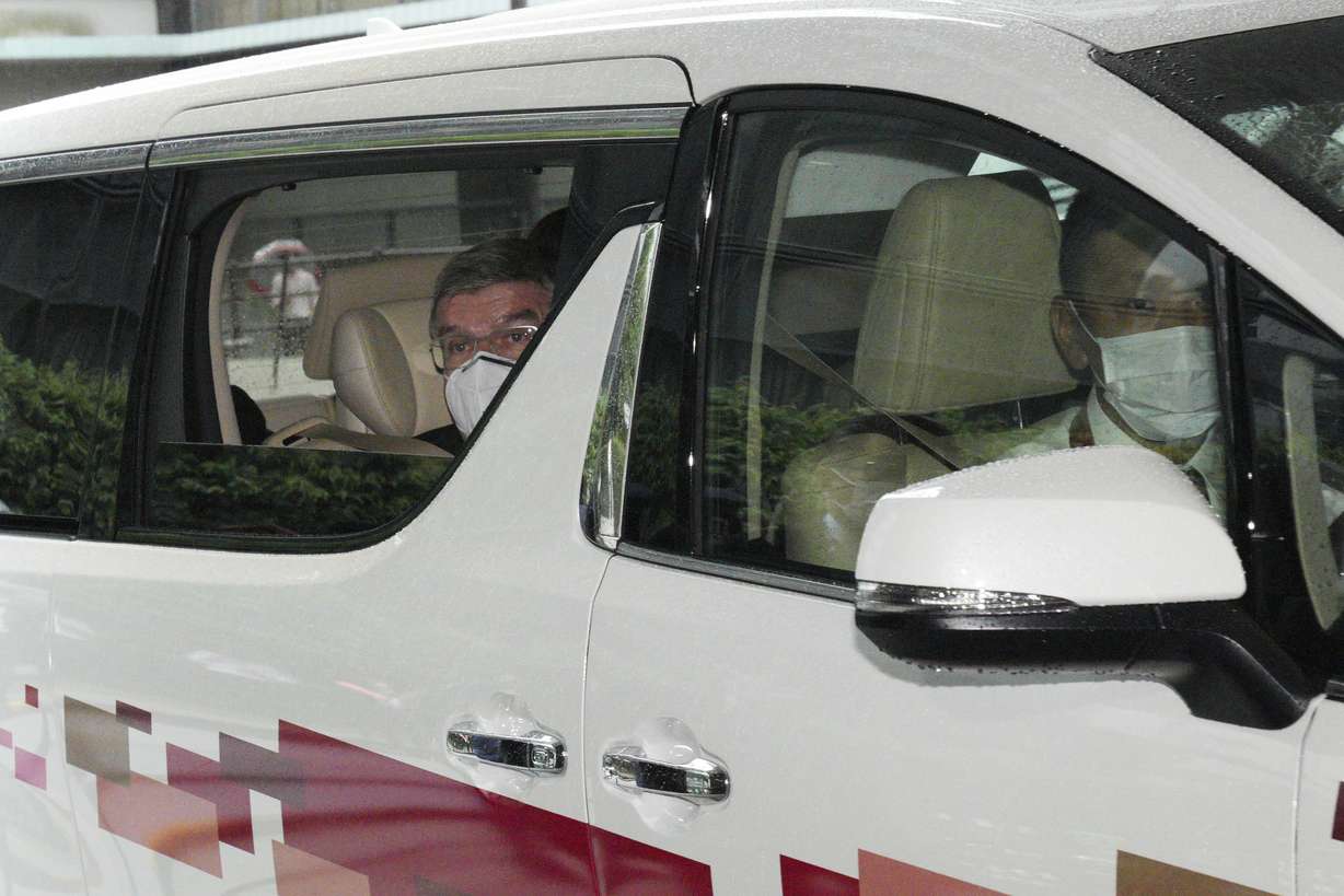 International Olympic Committee President Thomas Bach looks outside from the vehicle as he arrives at accommodation Thursday, July 8, 2021, in Tokyo.