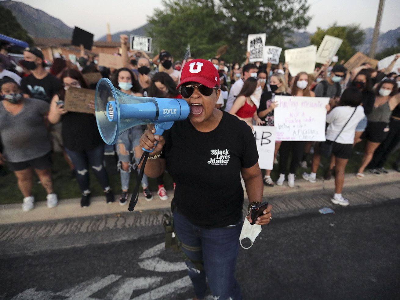 Lex Scott, founder of the Utah chapter of Black Lives Matter, chants as protesters and counterprotesters clash outside of
the Cottonwood Heights Police Department in Cottonwood Heights on Monday, Aug. 3, 2020. Days after the Black Lives Matter Utah chapter called the American flag a "symbol of hatred” and anyone who flies it "a racist” in a Fourth of July social media post that went viral, backlash from across the nation remains swift and relentless.