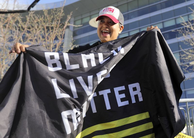 Lex Scott, founder of Black Lives Matter Utah, cheers
and celebrates during a rally in front of the Salt Lake City Public
Safety Building after a jury found former Minneapolis police
officer Derek Chauvin guilty in the killing of George Floyd on
Tuesday, April 20, 2021.