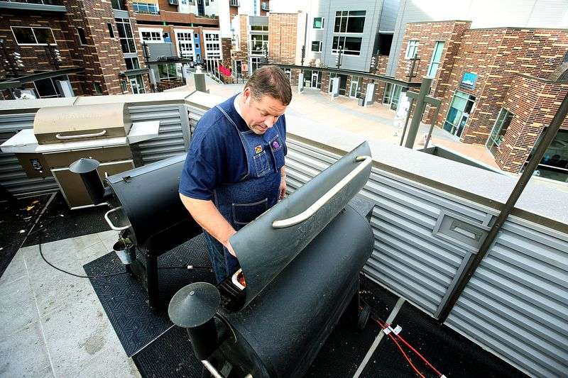 Pit master Curtis Nations makes lunch for Traeger
employees at Traeger Grills in Sugar House on Nov. 1,
2017.