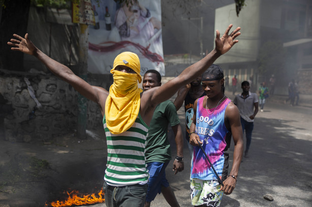 People protest against the assassination of Haitian President Jovenel Moïse near the police station of Petion Ville in Port-au-Prince, Haiti, Thursday, July 8, 2021.