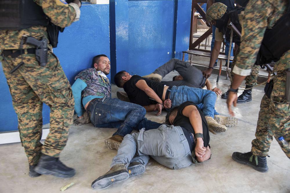 Suspects in the assassination of Haiti's President Jovenel Moïse are tossed on the floor after being detained, at the general direction of the police in Port-au-Prince, Haiti, Thursday, July 8, 2021. A Haitian judge involved in the murder investigation said that President Moise was shot a dozen times and his office and bedroom were ransacked.
