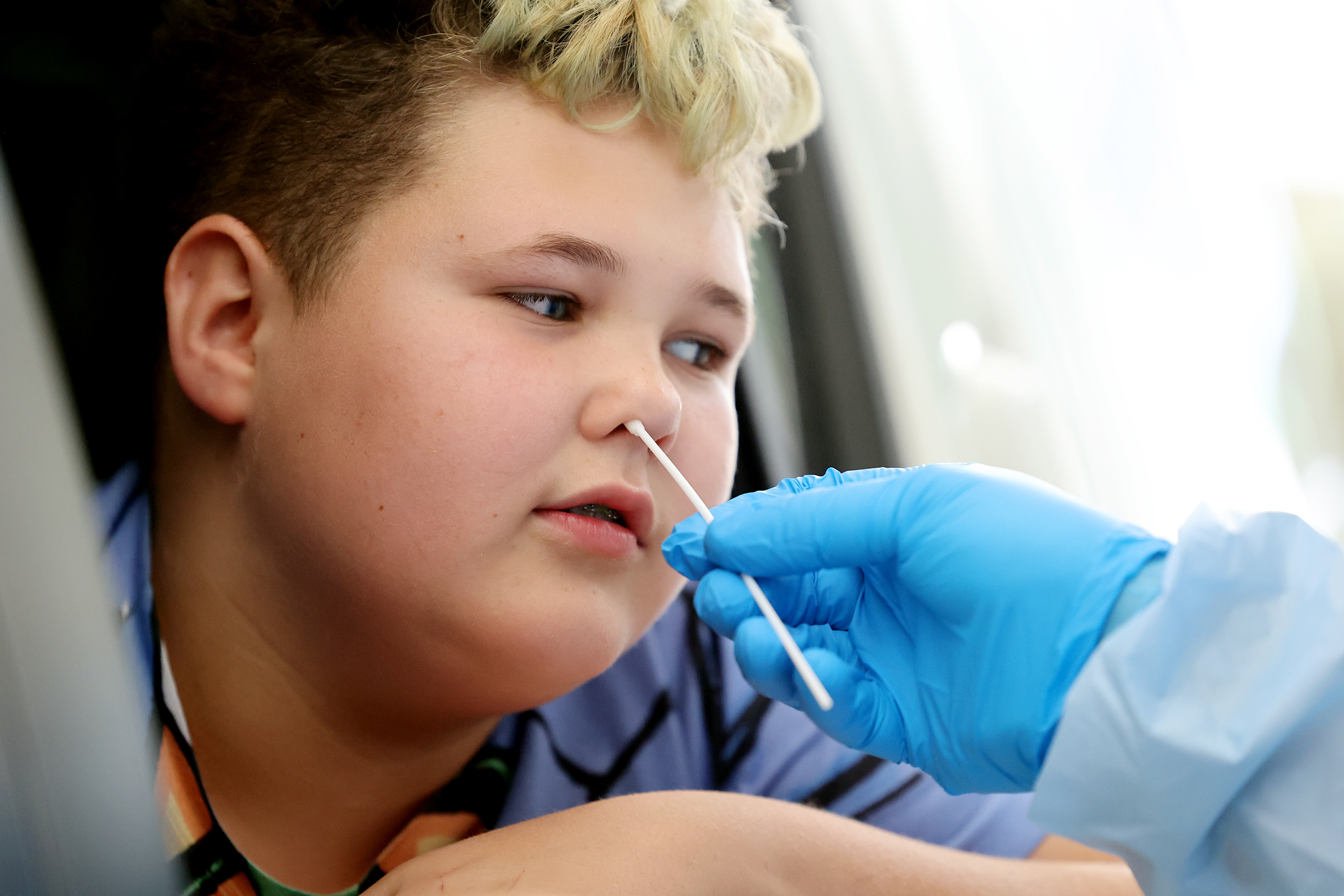 Isaac Kelly receives a COVID-19 test from Eric Kwiatkowski, with the Utah National Guard's Forward Support Company in St. George, at the Utah State Fairpark in Salt Lake City on Tuesday, July 6, 2021. Utah reported 655 new COVID-19 cases on Friday.