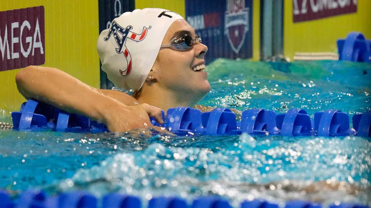 Rhyan White smiles after the women's 200-meter backstroke during wave 2 of the U.S. Olympic Swim Trials on Saturday, June 19, 2021, in Omaha, Neb.
