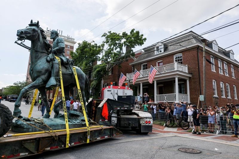 People look on as a statue of Confederate General Thomas "Stonewall" Jackson is removed after years of a legal battle over the contentious monument, in Charlottesville, Virginia, the U.S, July 10, 2021.
