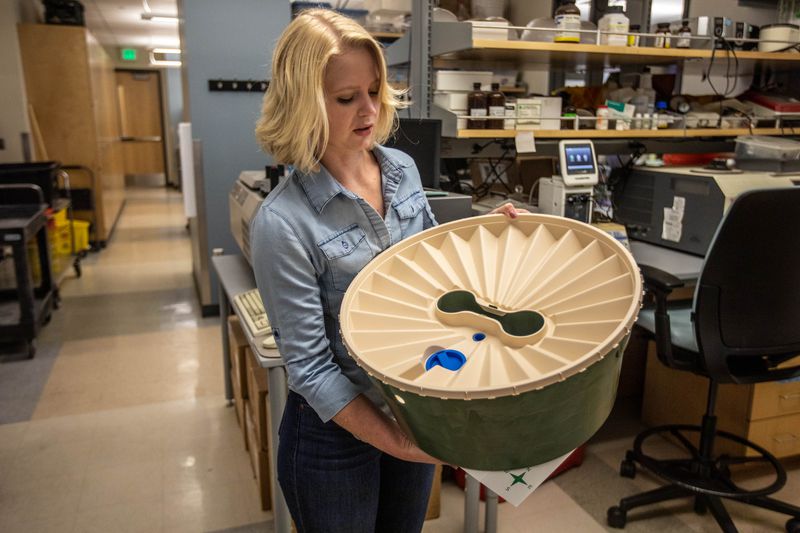 BYU graduate student Holley Lund shows how a waterboxx
works in a lab on the BYU campus in Provo on June 25, 2021.