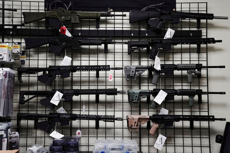 AR-15 style rifles are displayed for sale at Firearms Unknown, a gun store in Oceanside, California,  April 12, 2021.