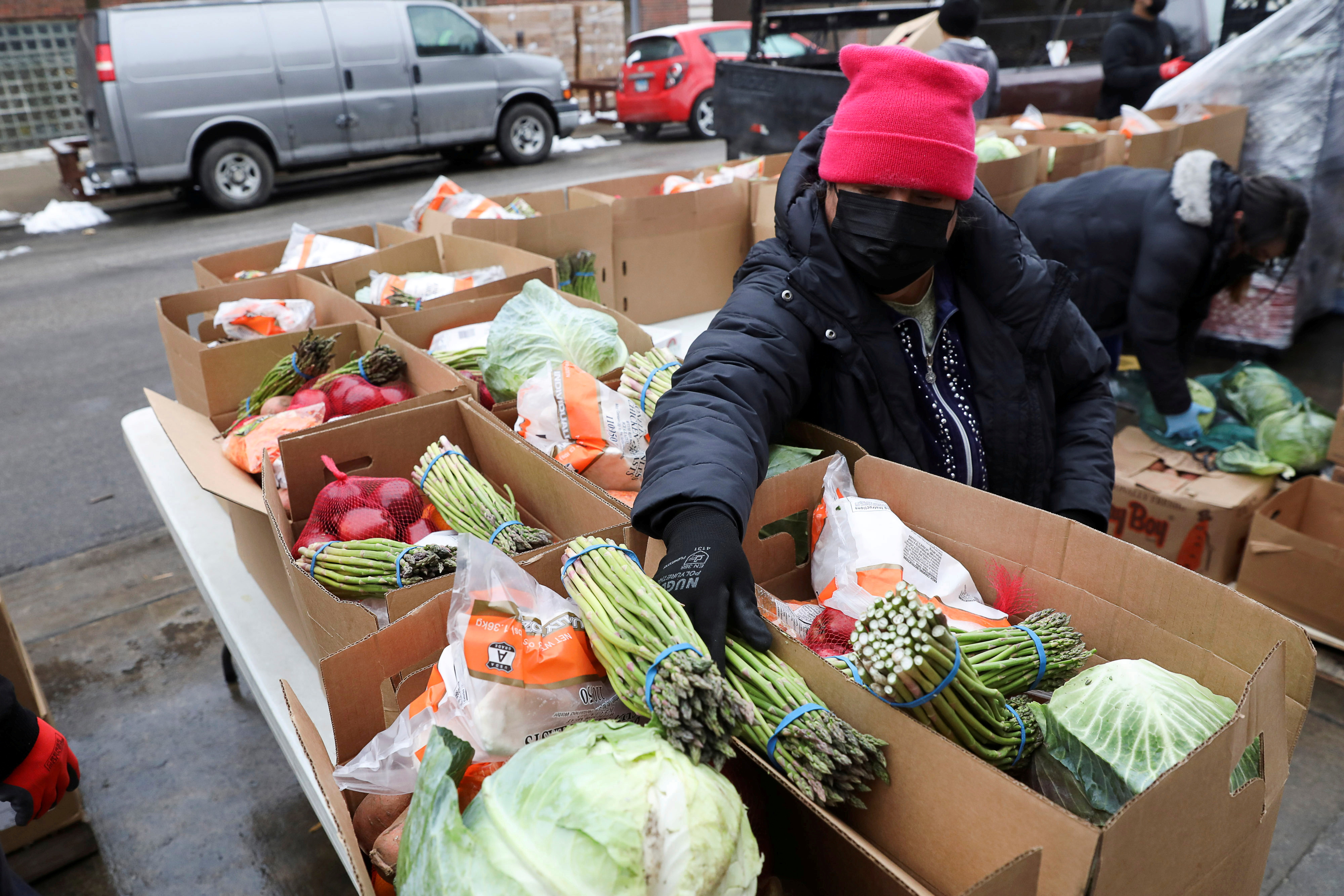 FILE: Food boxes are packed at the nonprofit New Life Centers' food pantry in Chicago, Illinois, U.S. March 16, 2021. 