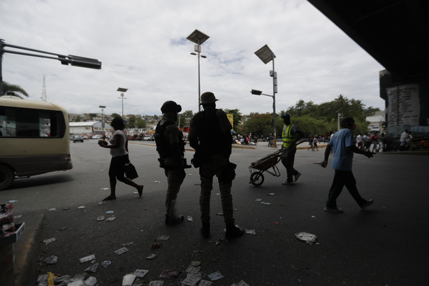 Police stand guard at an intersection in Port-au-Prince, Haiti, Monday, July 12, 2021.