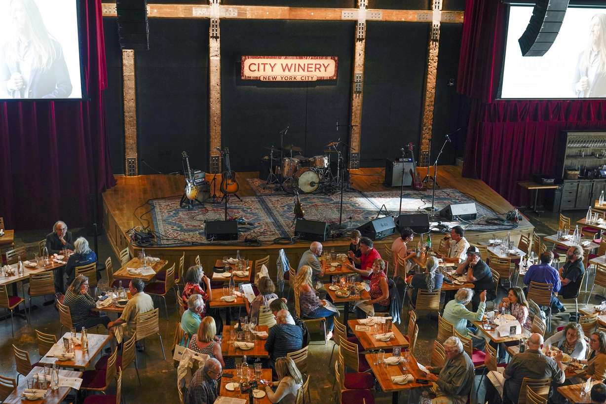 Patrons dine at City Winery on Thursday, June 24, 2021 file photo in New York. The economy's reopening from the pandemic has released pent-up demand as consumers increasingly travel, dine out, and shop after avoiding crowds for a year.
