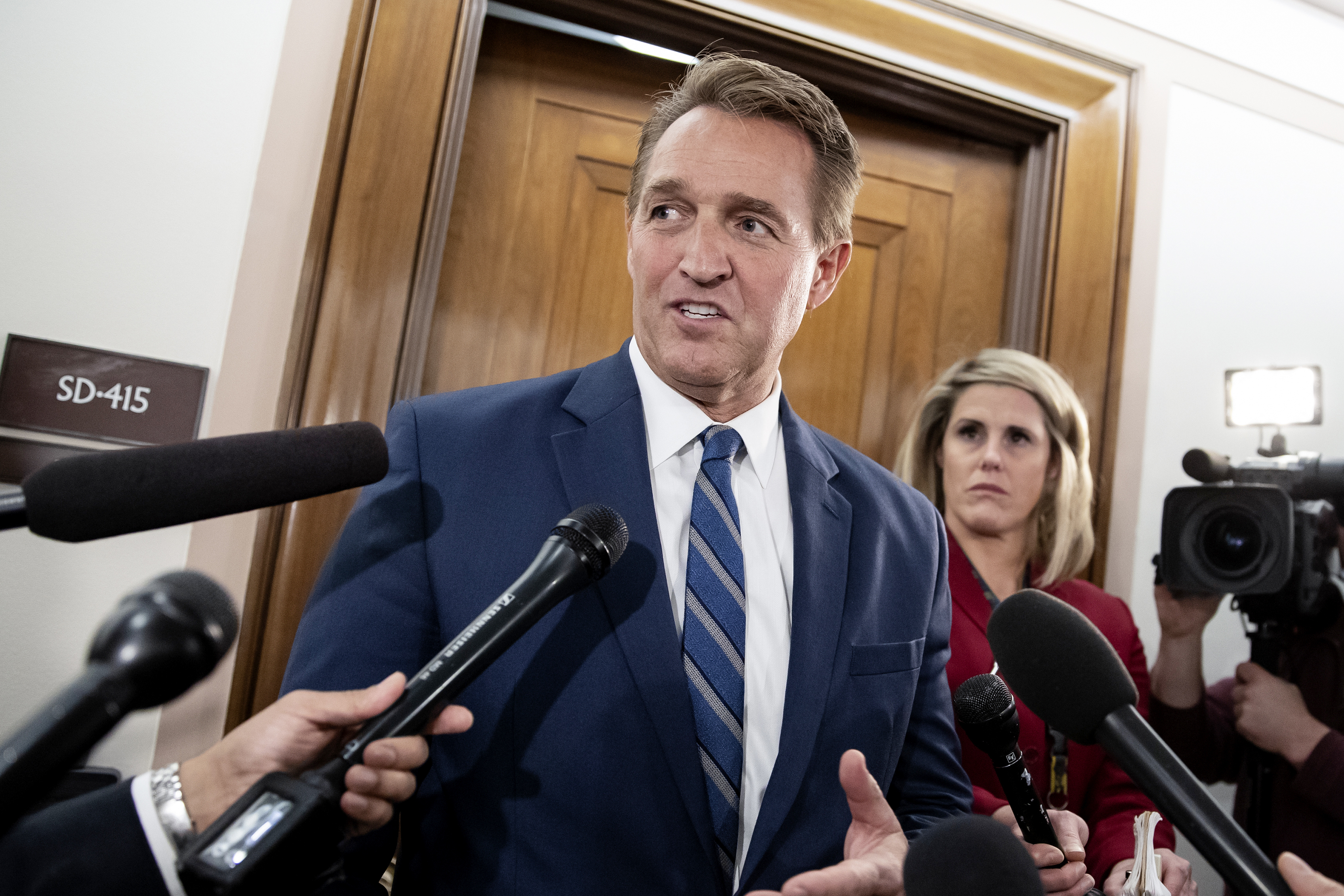 Sen. Jeff Flake, R-Ariz., speaks with reporters on Capitol Hill in Washington, on Thursday, Dec. 6, 2018.  President Joe Biden nominated former senator Jeff Flake on Tuesday to serve as ambassador to Turkey. The Republican had endorsed Biden's 2020 run for the White House.