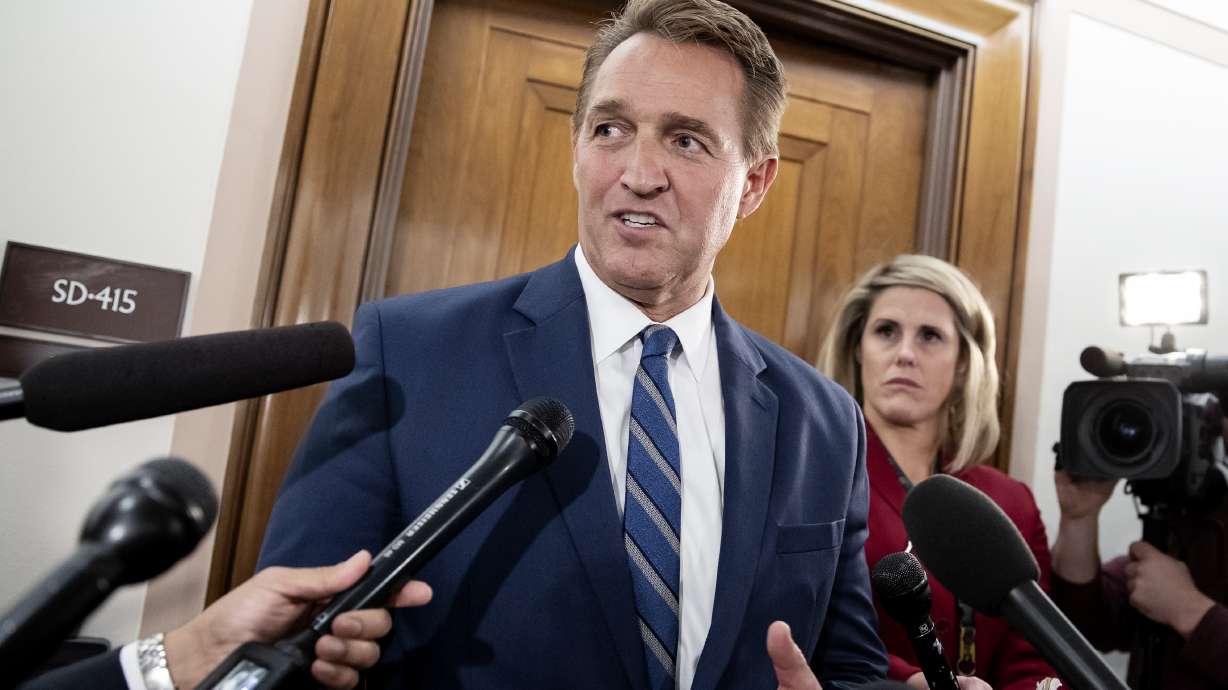 Sen. Jeff Flake, R-Ariz., speaks with reporters on Capitol Hill in Washington, on Thursday, Dec. 6, 2018. President Joe Biden nominated former senator Jeff Flake on Tuesday to serve as ambassador to Turkey. The Republican had endorsed Biden's 2020 run for the White House.