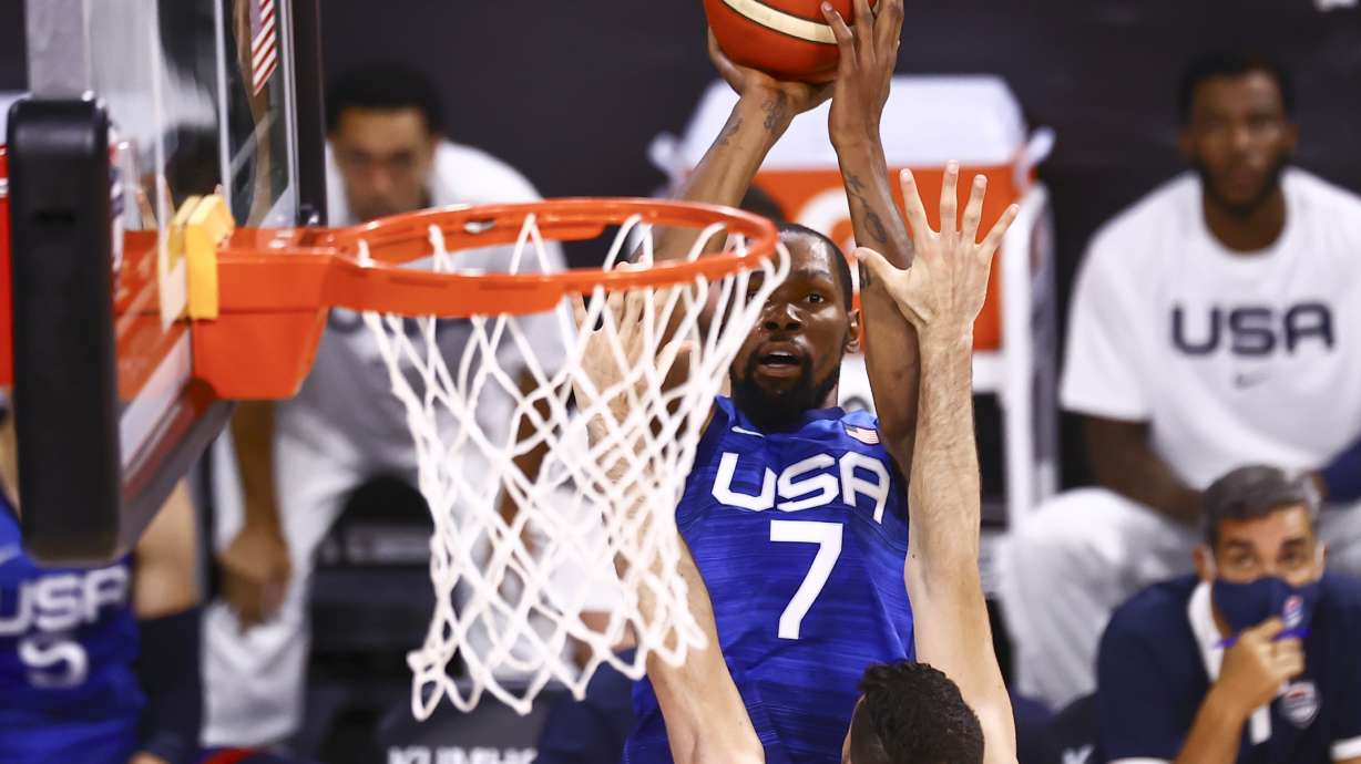 United States' Kevin Durant (7) shoots over Argentina's Patricio Garino during the first half of an exhibition basketball game in Las Vegas on Tuesday, July 13, 2021.