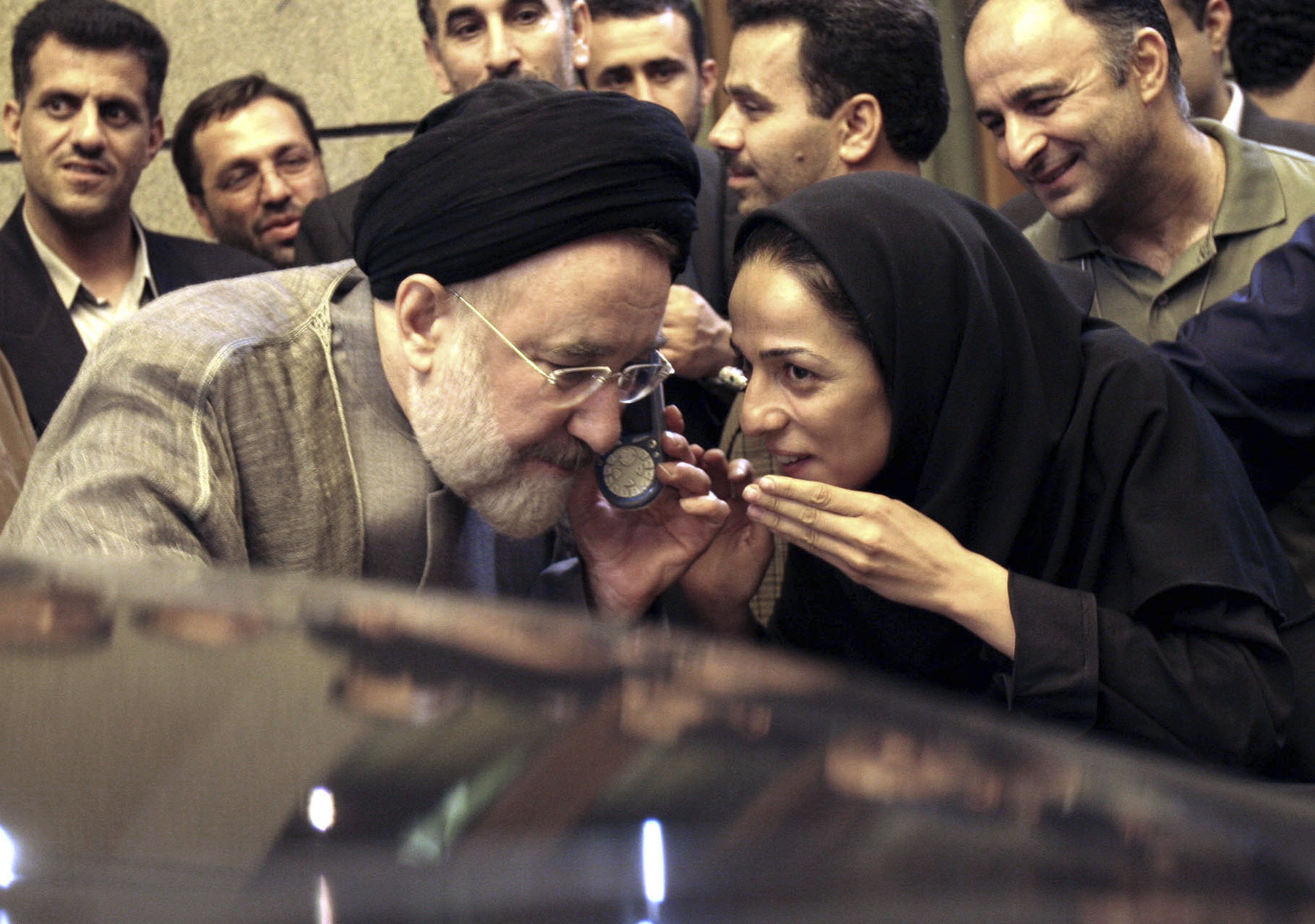 In this July 13, 2005, file photo, outgoing reformist Iranian President Mohammad Khatami talks on the phone with the mother of female journalist Masih Alinejad, right, after meeting with journalists in Tehran, Iran. Prosecutors in the U.S. alleged Tuesday, July 13, 2021, that Iran planned to kidnap Alinejad, famous for her campaign against the Islamic Republic's mandatory headscarf, or hijab, for women.