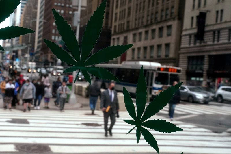 Cannabis stickers on a Weed World store window are pictured the day New York state legalized recreational marijuana use amid the COVID-19 pandemic in the Manhattan borough of New York City, March 31, 2021.