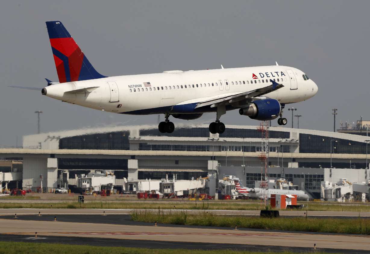A Delta Airlines aircraft makes its approach at Dallas-Fort Worth International Airport in Grapevine, Texas, in this Monday, June 24, 2019, file photo.