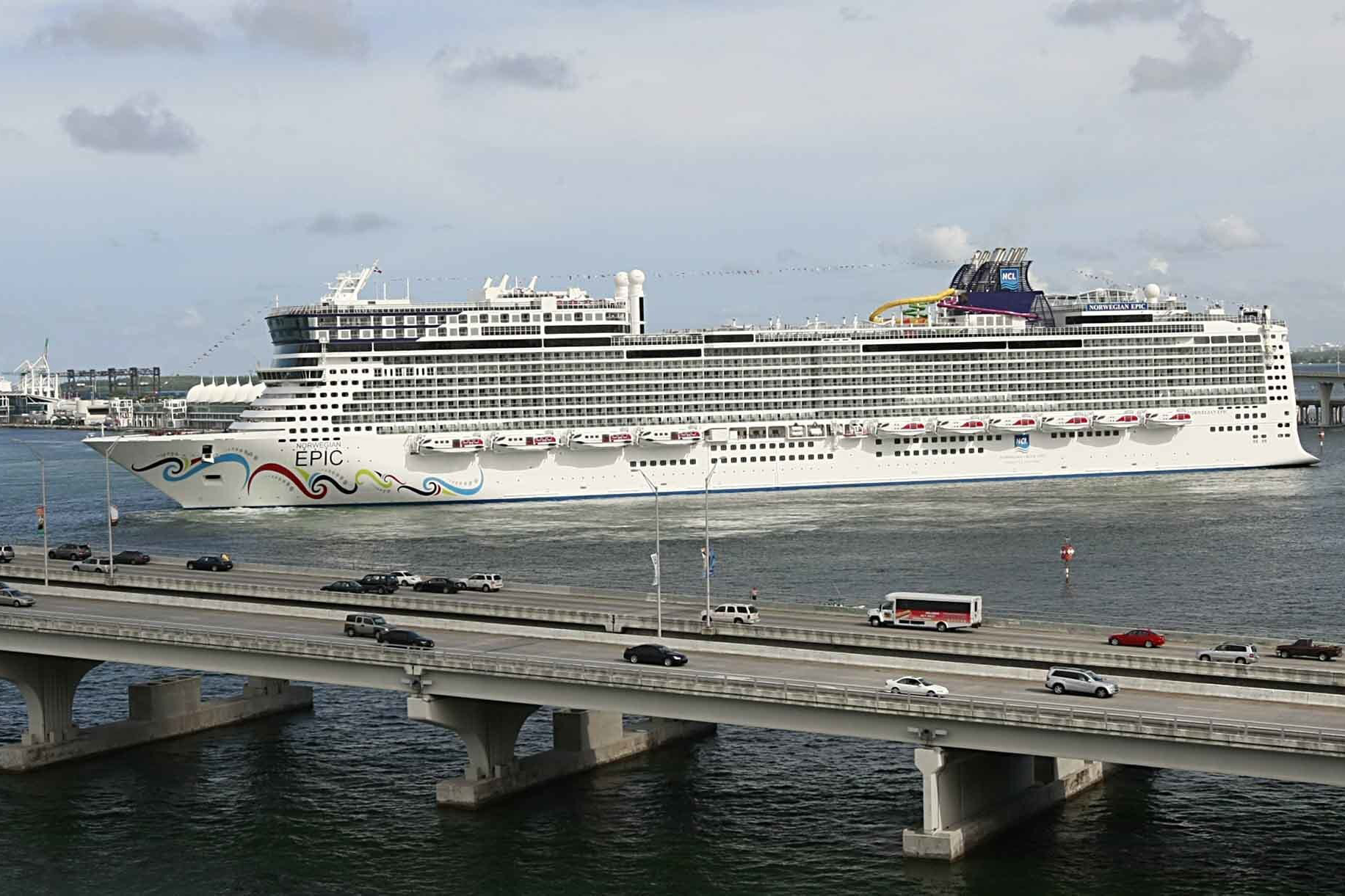 In this July 7, 2010, file photo, the Norwegian Epic, owned by the Norwegian Cruise Line Corporation, sails through the Government Cut to the Port of Miami in Miami. Norwegian Cruise Line is challenging a new Florida law that prevents cruise companies from requiring passengers to show proof of vaccination against the COVID-19 virus.