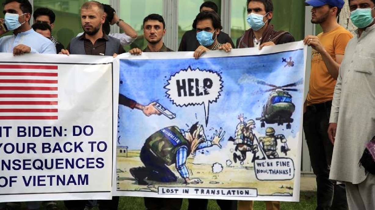 Former Afghan interpreters hold banners during a protest against the U.S. government and NATO in Kabul, Afghanistan, on April 30, 2021. The Biden administration is set to begin evacuations of Afghan interpreters and translators who aided the U.S. military effort in the nearly 20-year war, an administration official said.