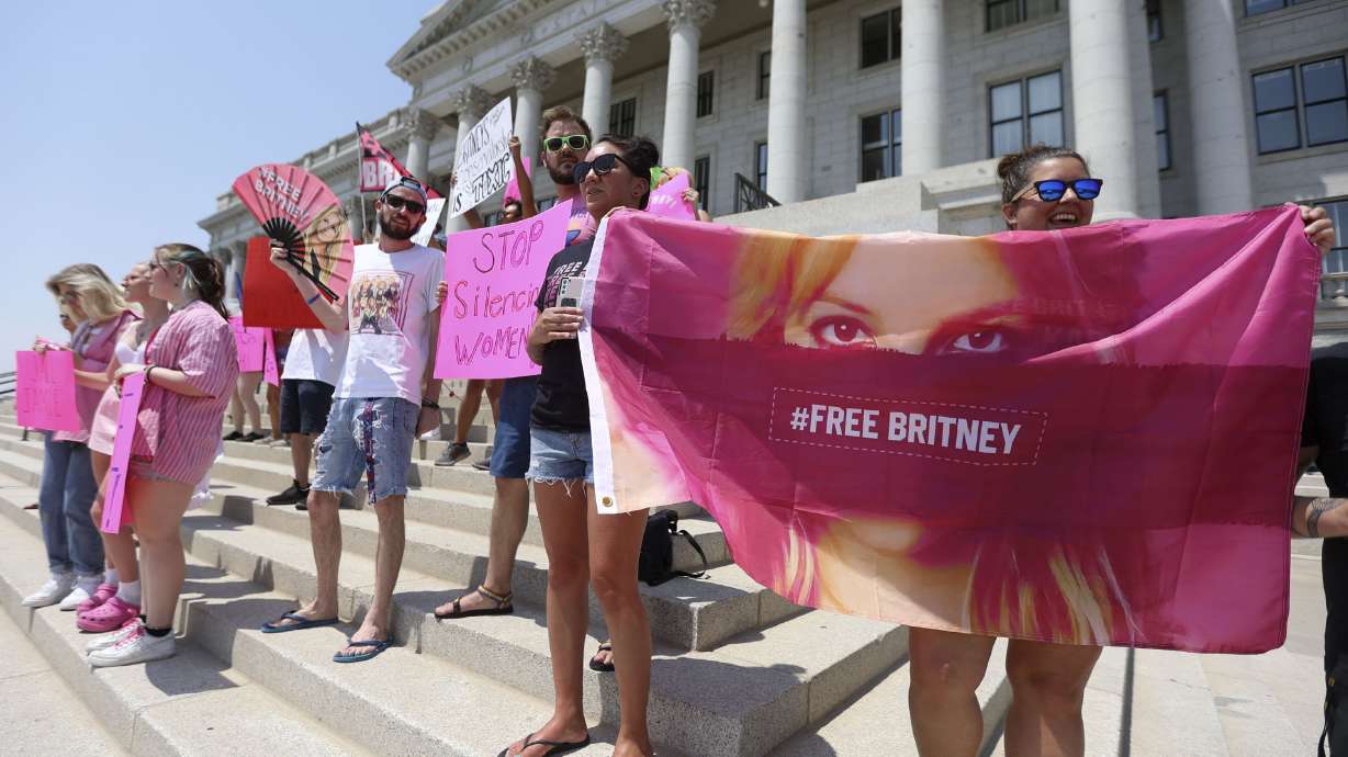 Ashley Segura and Chelsea Dauwalder hold a #FreeBritney banner during a Free Britney Rally outside of the Capitol in Salt Lake City on Wednesday, July 14, 2021.