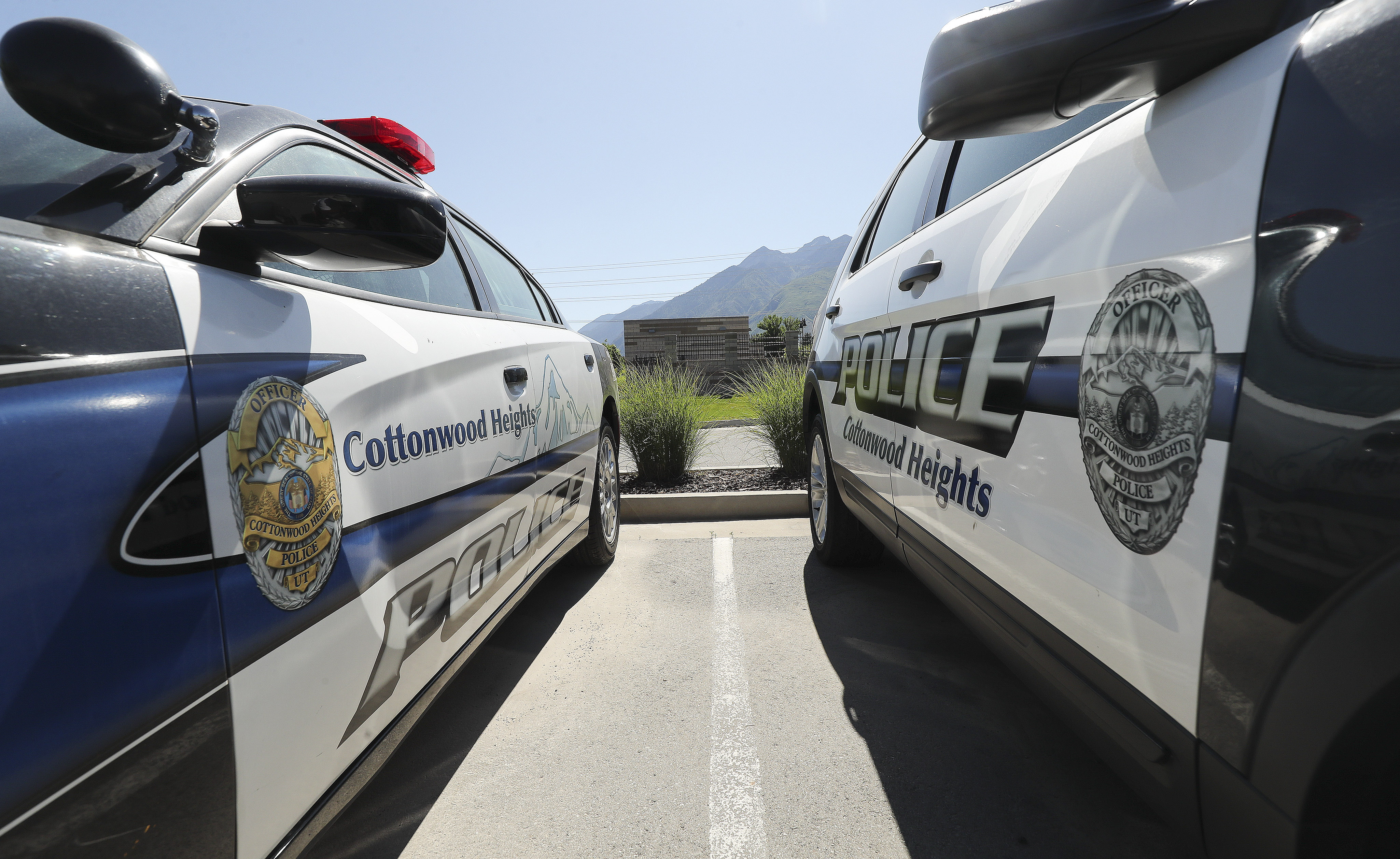 Cottonwood Heights police are looking for a man accused of yelling racial slurs at a business owner and customer on Wednesday.