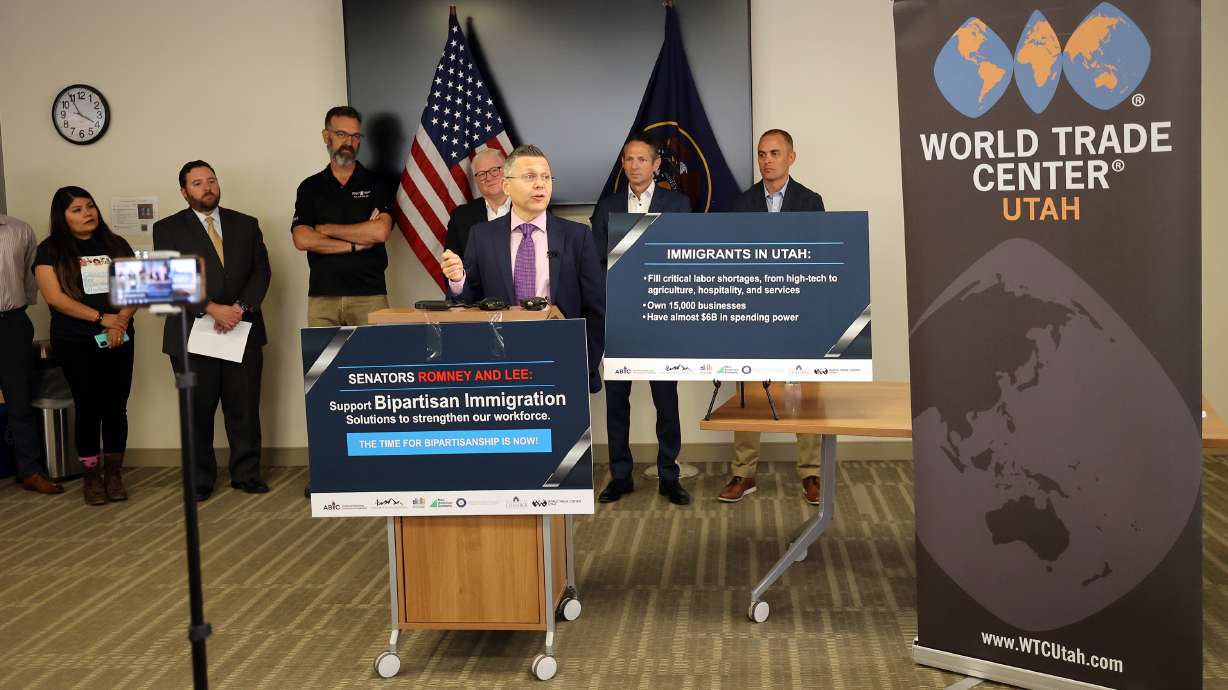 Mikhail Shneyder, president and CEO of Nightingale College, joins a group calling on Utah’s senators to support bipartisan immigration reform during a press conference at the World Trade Center Utah offices in Salt Lake City on Wednesday, July 14, 2021.