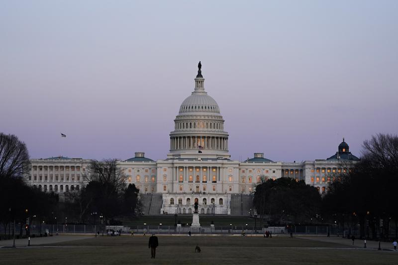 The U.S. Capitol building is shown after sunset Thursday, March 4, 2021, in Washington. The Biden administration is beginning to distribute expanded child tax credit payments, giving parents on average $423 in July 2021, with payments continuing through the end of the year.