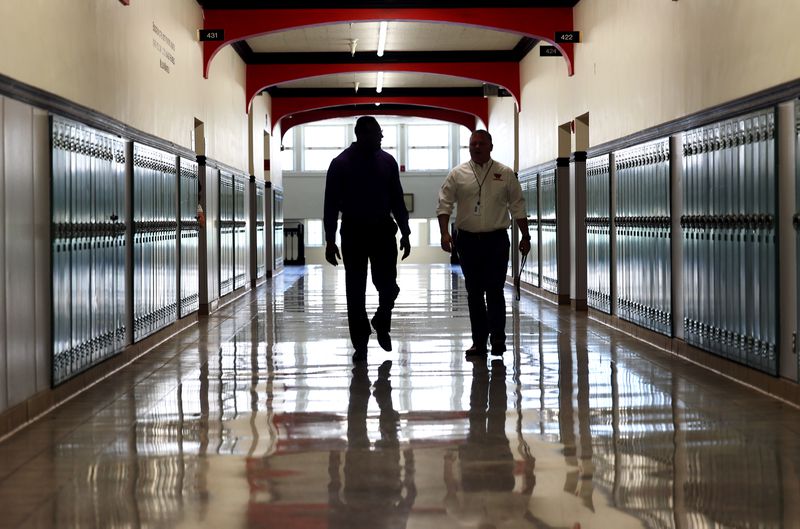 Timothy Gadson, incoming Salt Lake City School District
superintendent, left, walks with West High School Principal Jared
Wright as Gadson tours the school in Salt Lake City on Tuesday,
June 29, 2021. Gadson will take the helm of the district in
July.
