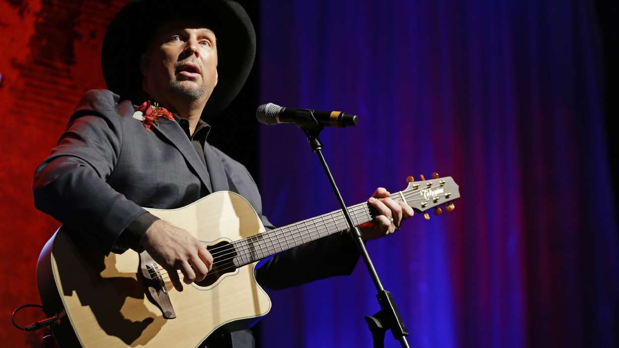 In this Sunday, Oct. 7, 2012 file photo, Garth Brooks performs during the Nashville Songwriters Hall of Fame inductions in Nashville, Tenn. Garth Brooks is scheduled to perform at Rice-Eccles Stadium on July 17, 2021.