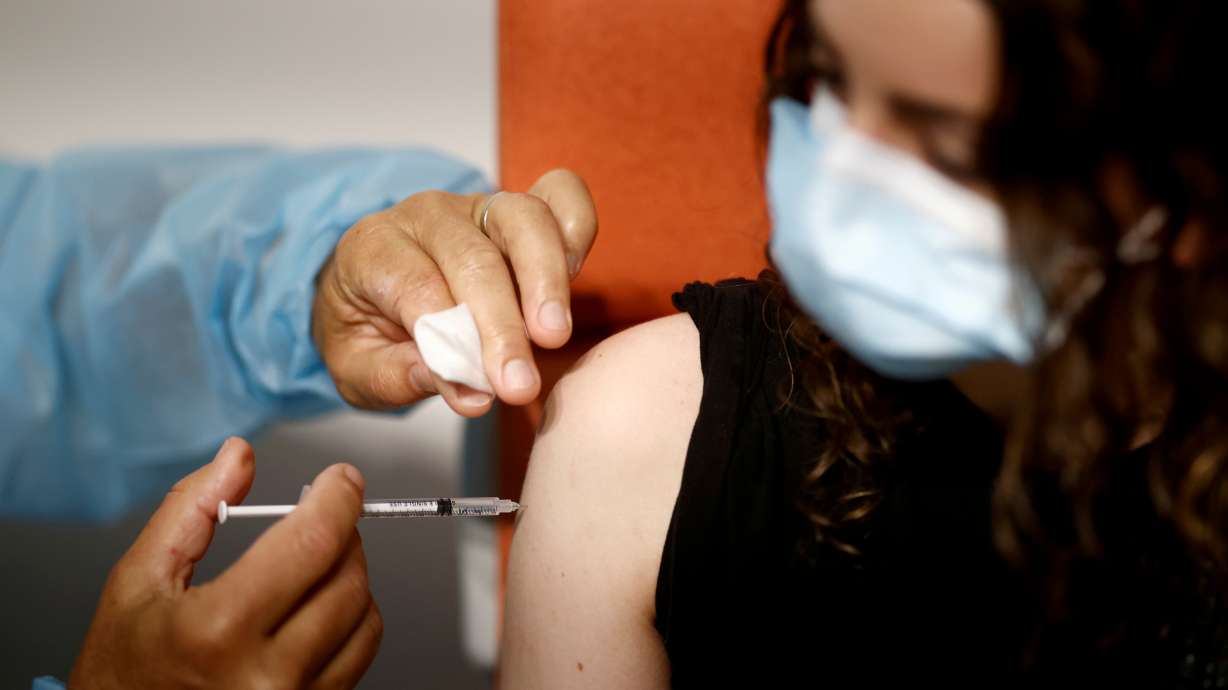 A medical worker administers a dose of the "Comirnaty" Pfizer BioNTech COVID-19 vaccine in a vaccination center in Nantes as part of the coronavirus disease vaccination campaign in France, June 3, 2021. The Delta variant of COVID-19 is now the dominant strain worldwide, accompanied by a surge of deaths around the United States almost entirely among unvaccinated people, U.S. officials said on Friday, July 16, 2021.