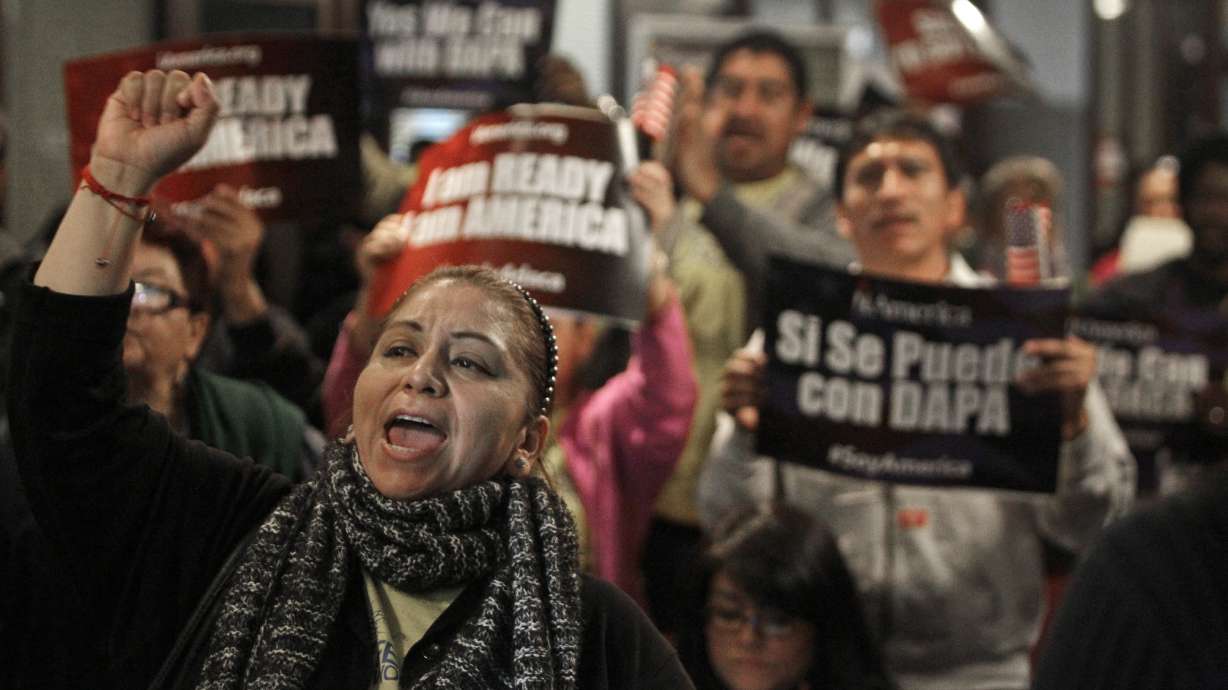 Protesters chant during an event on DACA and DAPA Immigration Relief in Houston on Feb. 17, 2015. A federal judge in Texas on Friday, July 16, 2021, ordered an end to an Obama-era program that prevented the deportations of some immigrants brought into the United States as children.