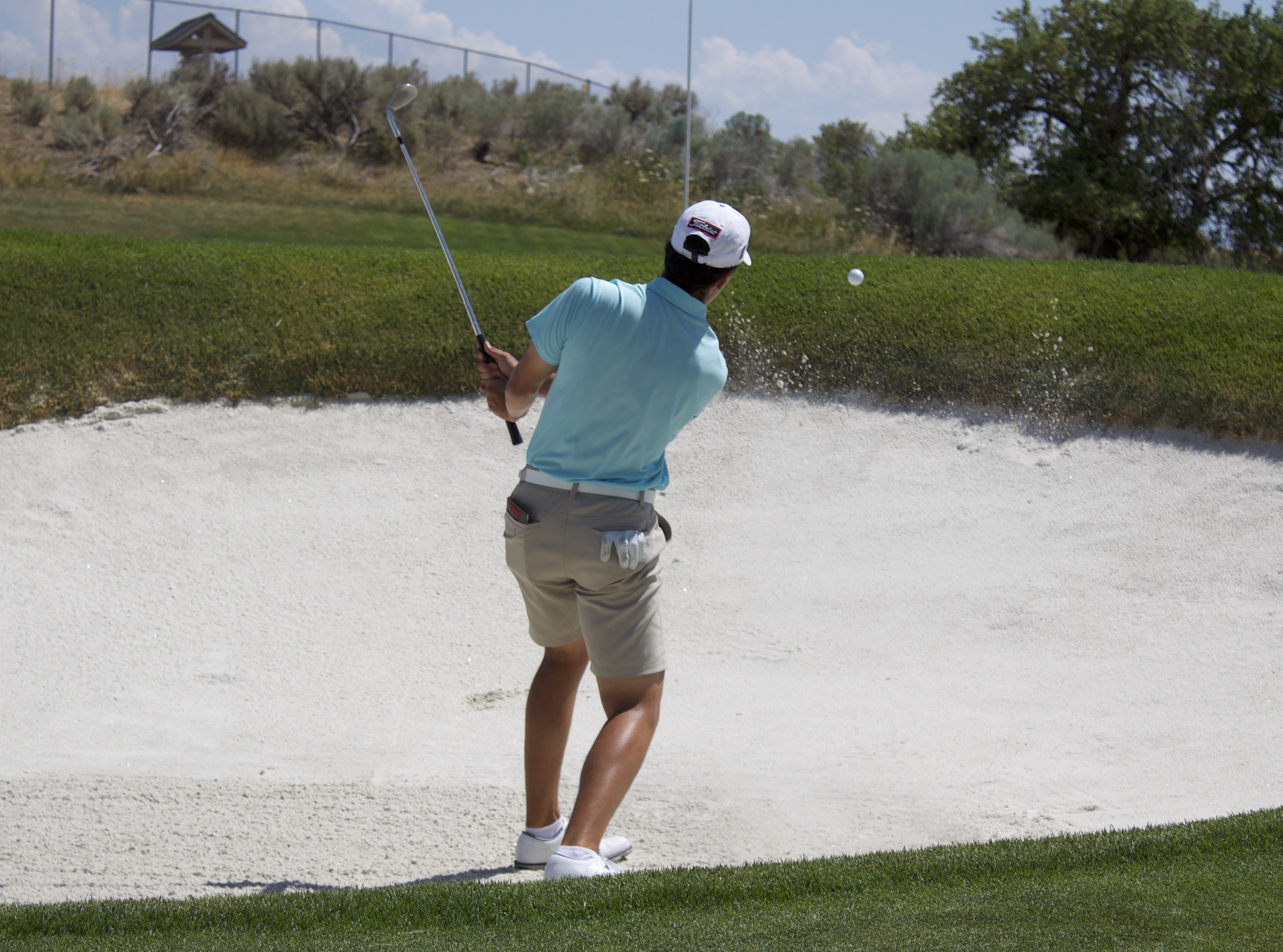 Utah freshman Martin Leon hits out of the bunker during the semifinals of the 123rd Utah State Amateur championship, Friday, July 16, 2021 at Alpine Country Club.