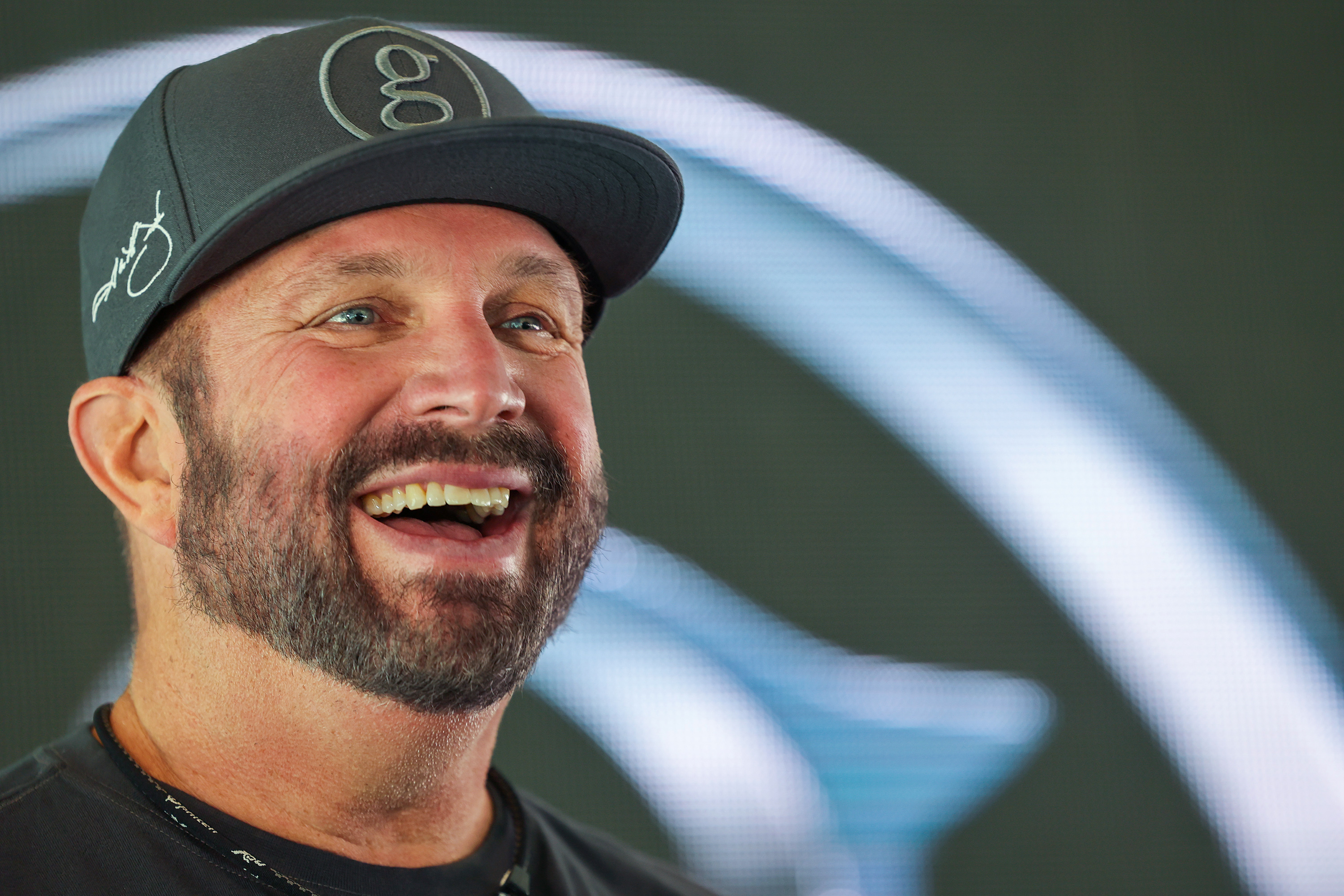 Country music superstar Garth Brooks talks with members of the media during a press conference at the University of Utah's Rice-Eccles Stadium in Salt Lake City on Friday, July 16, 2021.