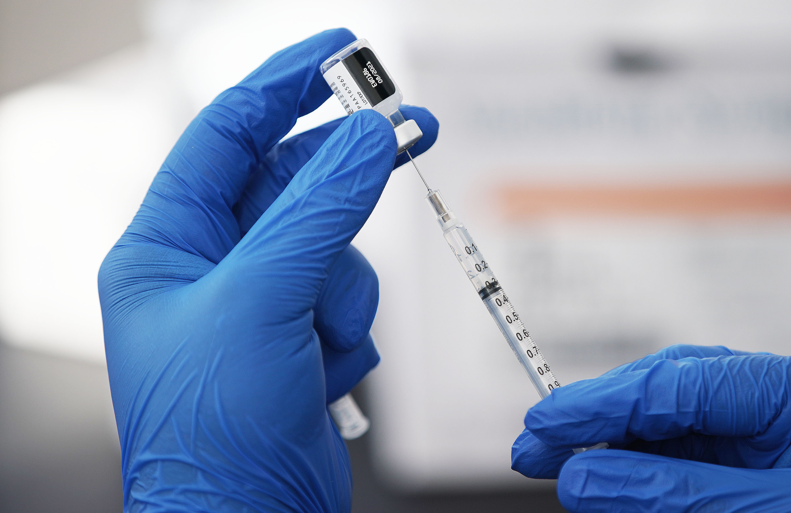 A COVID-19 vaccine is prepared at pop-up clinic sponsored by the Davis County Health Department in the parking lot of Kent's Market in Clearfield on Wednesday, June 23. The Utah Department of Health reported seven COVID-19 deaths in the state Tuesday.