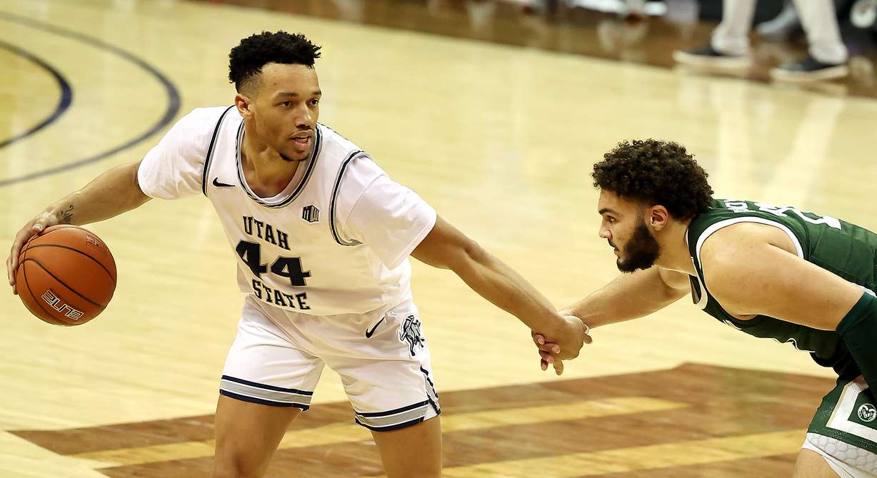 Utah State Aggies guard Marco Anthony (44) looks to get around Colorado State Rams guard David Roddy (21) as their hands come together as Utah State and Colorado State play in the Mountain West Tournament at the Thomas & Mack Center in Las Vegas on Friday, March 12, 2021. Utah State won 62-50.