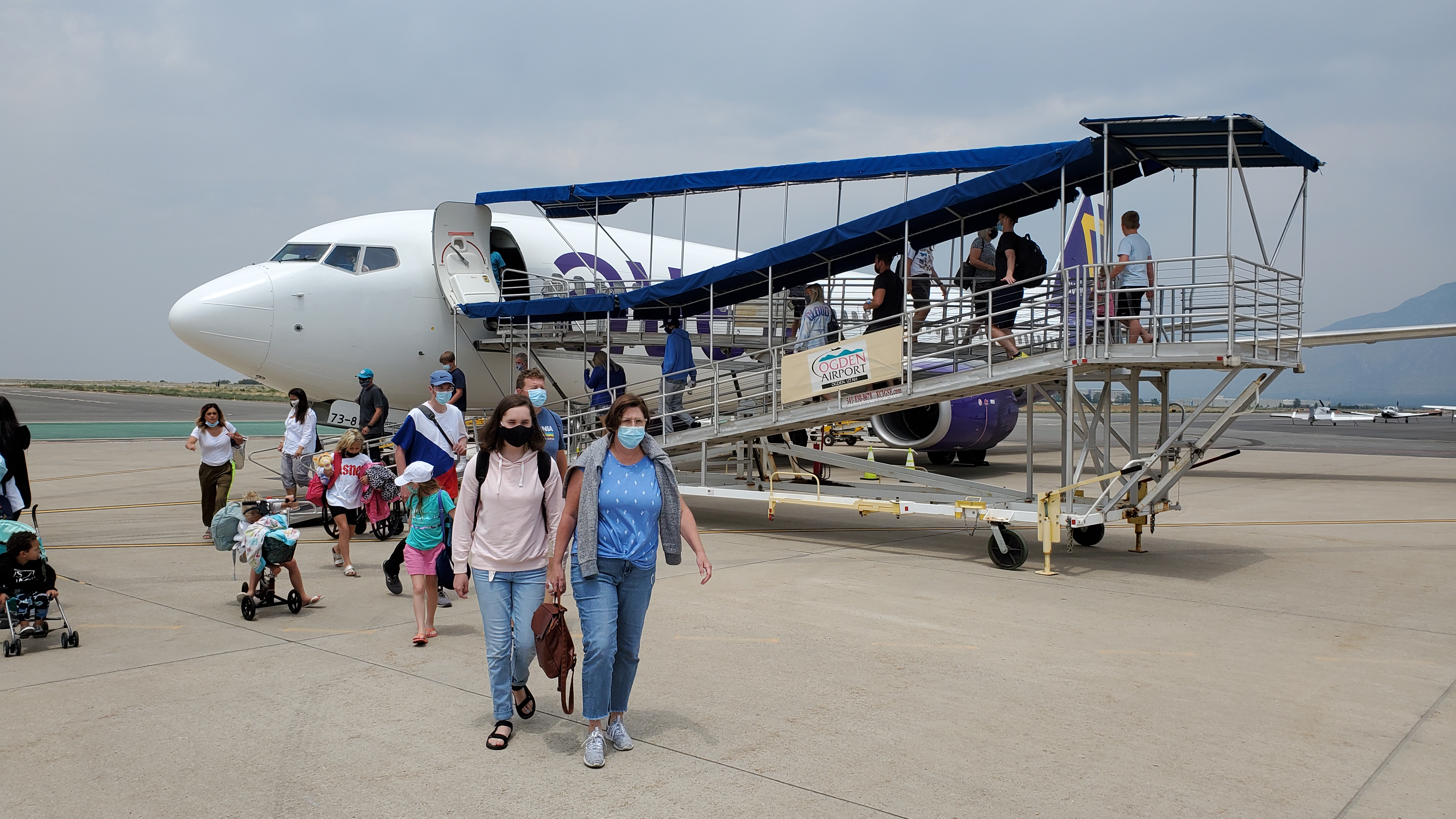 Passengers depart an Avelo Airlines flight at Ogden-Hinckley Airport in July 2021. The low-cost airline announced Wednesday it will offer new service between Salt Lake City and Santa Rosa, Calif., beginning in October.