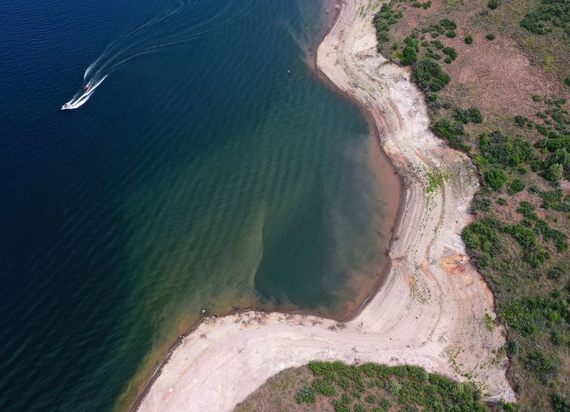 A boater enjoys the water at Jordanelle State Park on Friday, July 16, 2021. The water levels are low due to drought.