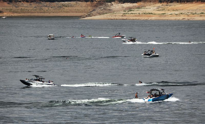 Boaters enjoy the water at Jordanelle State Park on Friday, July 16, 2021. The water levels are low due to
drought.