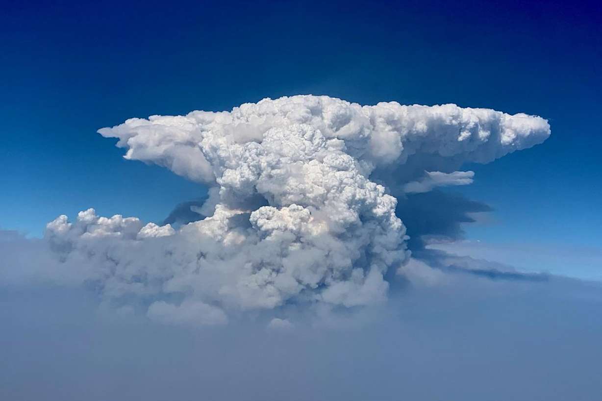 In this photo taken with a drone provided by the Bootleg Fire Incident Command, a pyrocumulus cloud, also known as a fire cloud, is seen over the Bootleg Fire in southern Oregon on Wednesday, July 14, 2021.