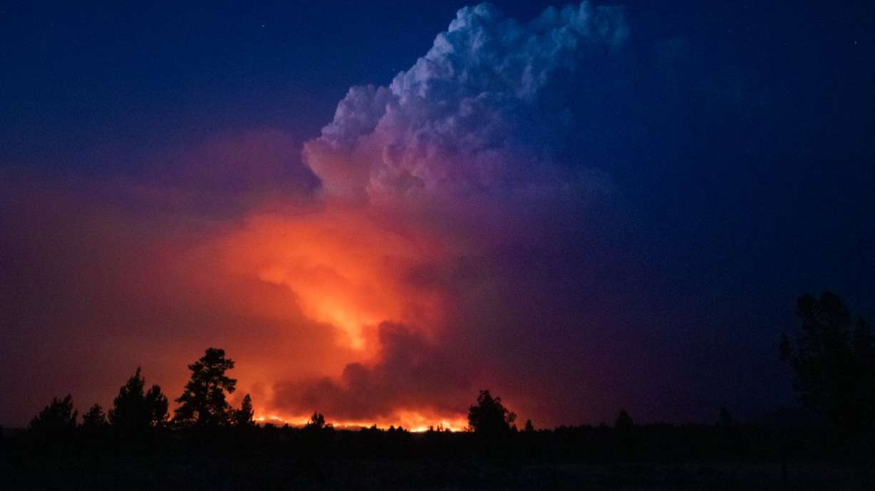 Flames and smoke rise from the Bootleg fire in southern Oregon on Wednesday, July 14, 2021. The largest fire in the U.S. on Wednesday was burning in southern Oregon.