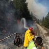 Hot, gusty winds fanning flames of massive US wildfires