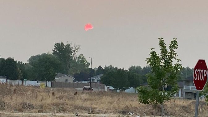 Sunrise over the Wasatch Mountains, taken from West Jordan. Colored red by the smoke from Oregon wildfires.