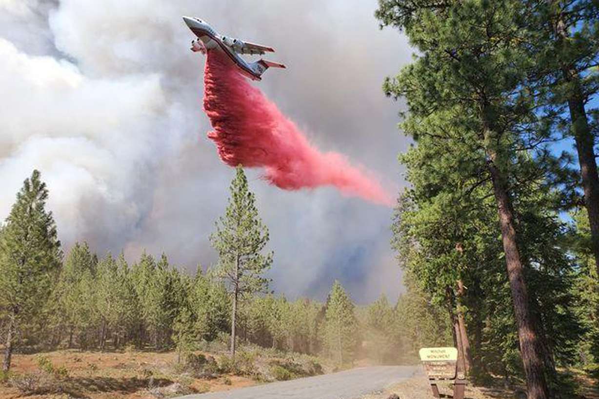 A tanker drops retardant over the Mitchell Monument area at the Bootleg Fire in southern Oregon on Saturday, July 17, 2021. The 569-square-mile Bootleg Fire is burning 300 miles southeast of Portland in and around the Fremont-Winema National Forest.