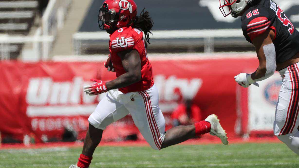 Utah Utes running back Chris Curry (0) runs during the Red and White game in Salt Lake City on Saturday, April 17, 2021.