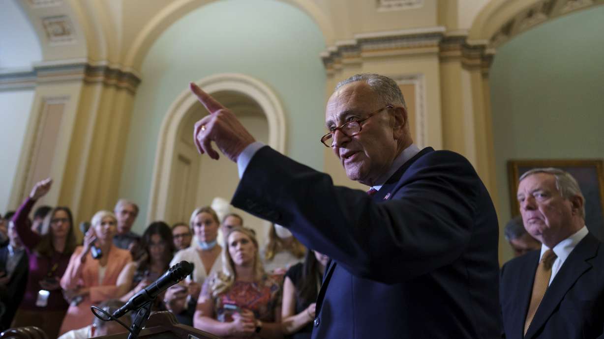 Senate Majority Leader Chuck Schumer, D-N.Y., calls on reporters as he talks about his plans for a procedural vote tomorrow on the bipartisan infrastructure deal senators brokered with President Joe Biden, at the Capitol in Washington on Tuesday, July 20, 2021.