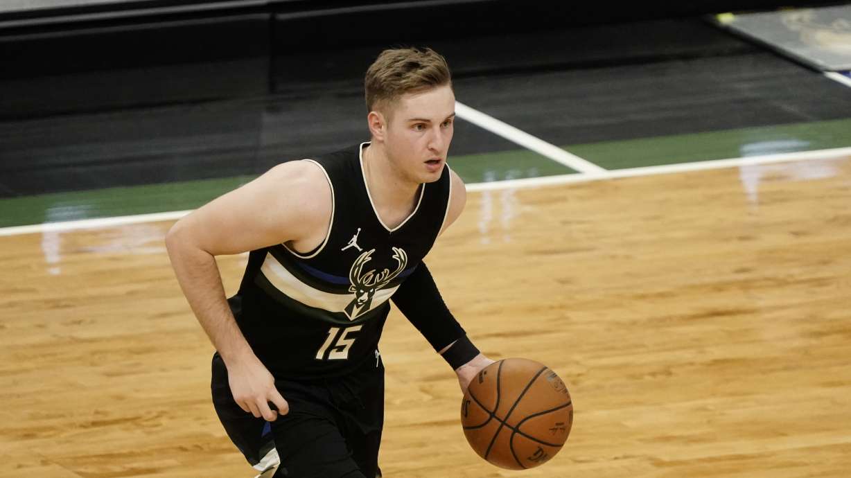 Milwaukee Bucks' Sam Merrill dribbles during the second half of an NBA basketball game against the Charlotte Hornets Friday, April 9, 2021, in Milwaukee.