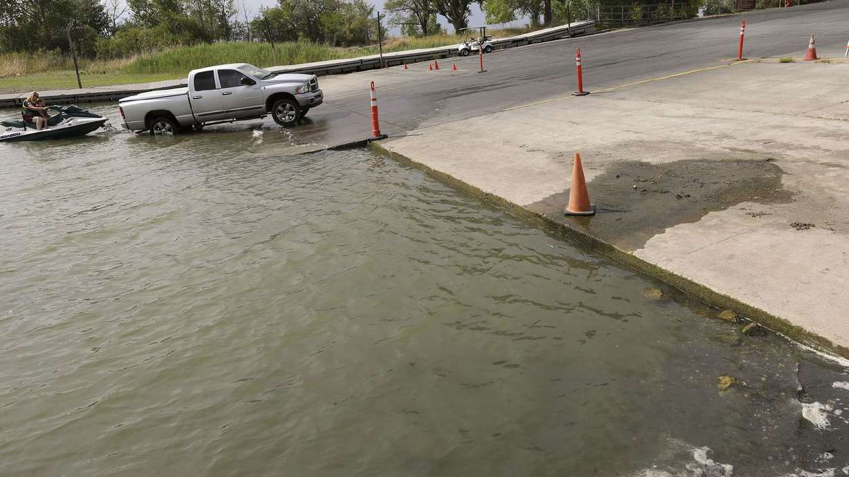 People put a jet ski in the water next to a boat ramp that is closed and has an abrupt drop-off due to low water at the
Willard Bay North Marina in Willard, Box Elder County, on Monday, July 19, 2021.